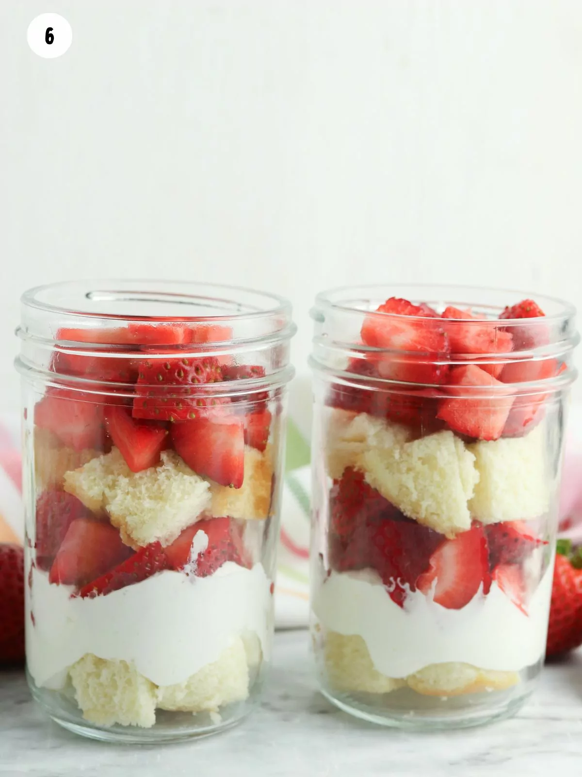 pound cake, strawberries and whipped cream in masno jars.
