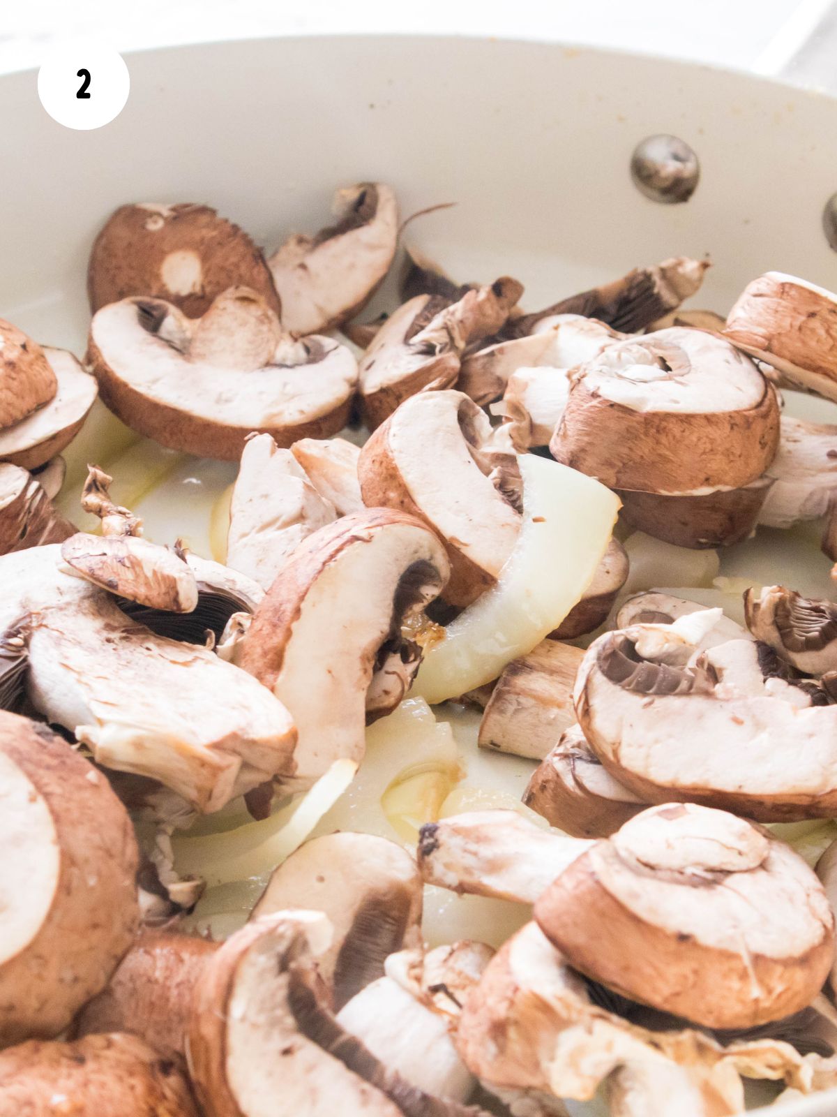 mushrooms and onion in skillet.