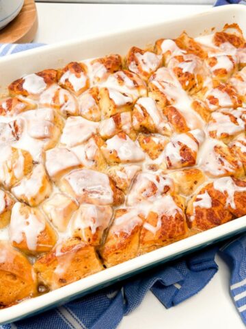 Cinnamon Rolls with Apple Pie Filling & Heavy Cream served in a casserole dish.