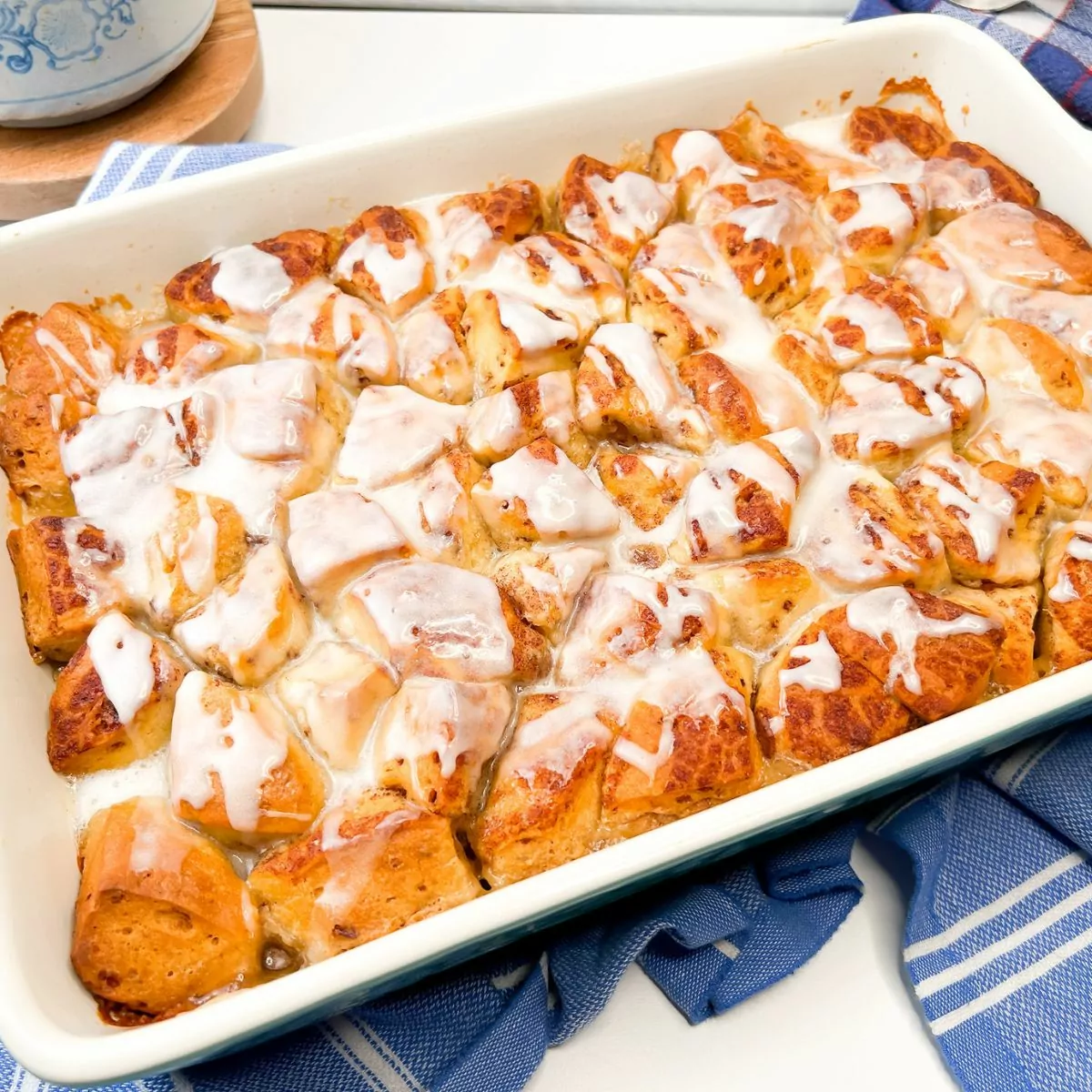 Cinnamon Rolls with Apple Pie Filling & Heavy Cream served in a casserole dish.