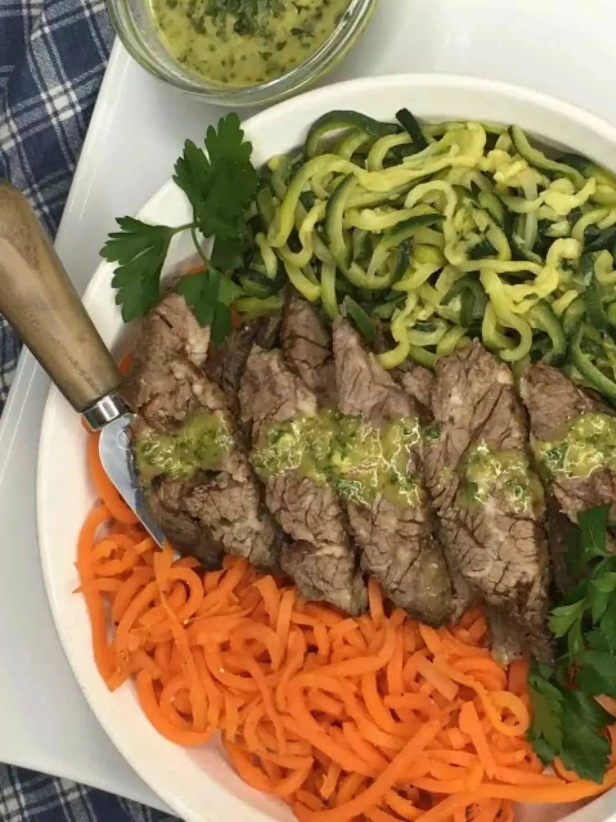 green giant veggie spirals with steak on plate.
