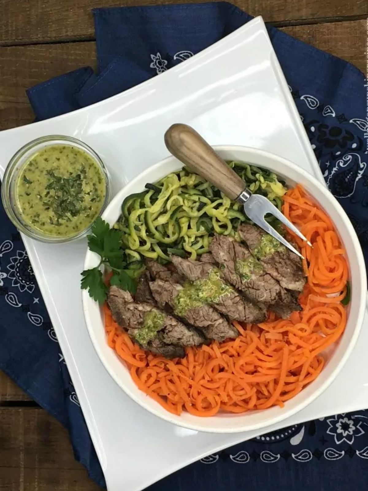 grilled steak with veggie spirals.