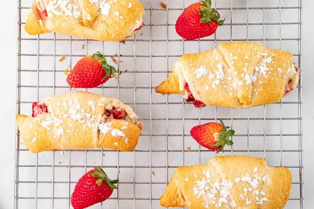 Strawberry Cream Cheese Crescent Rolls on a wire rack