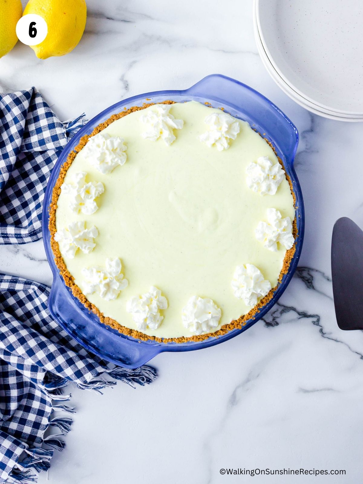 decorated frozen dessert in pie plate with whipped cream.