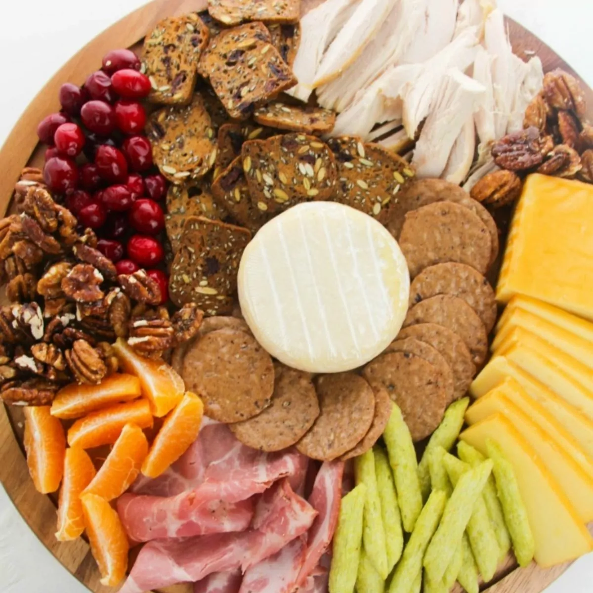 Snack Board with cheese, veggies and cured meats.