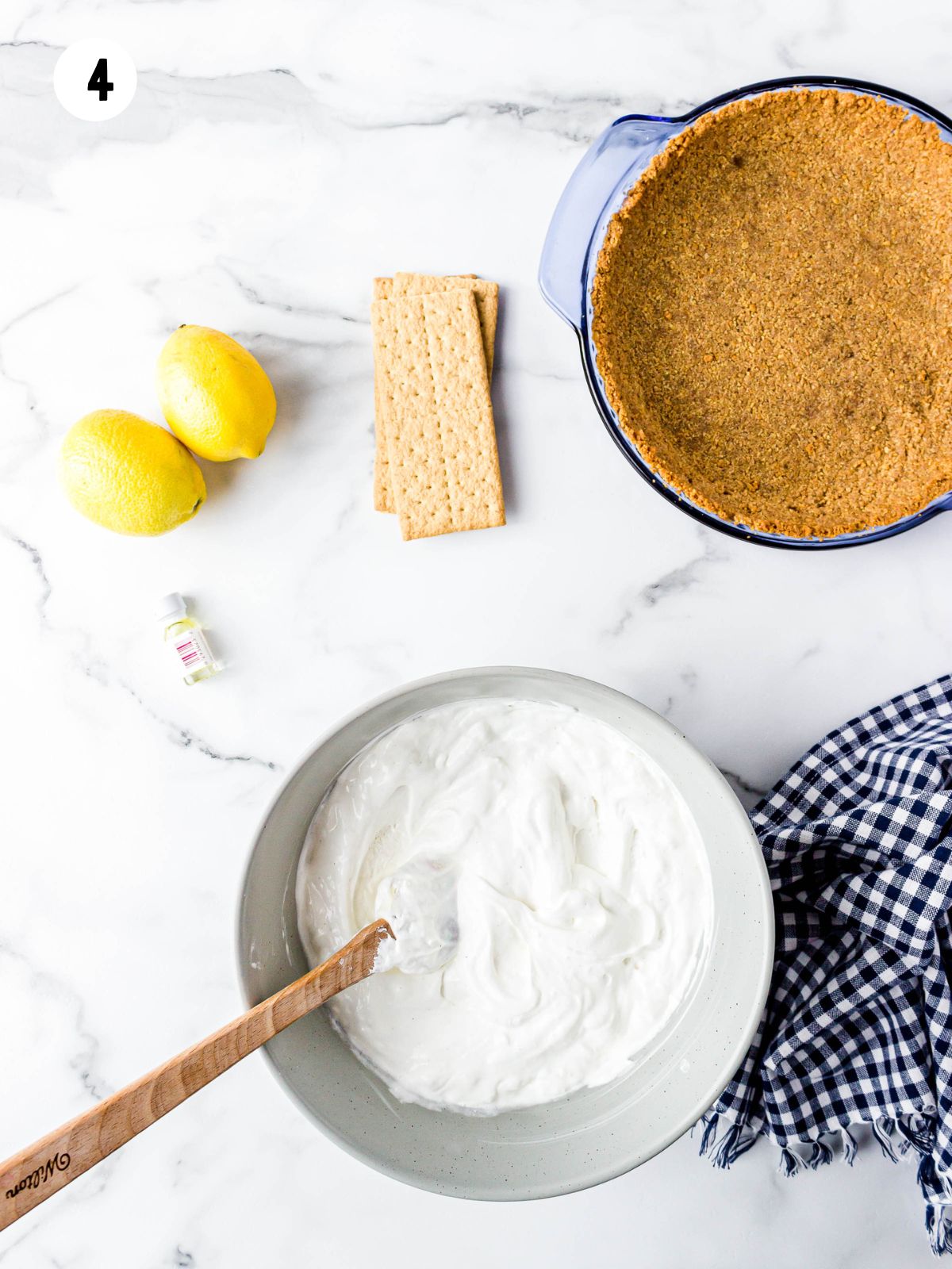 whipped topping in bowl with rubber spatula.