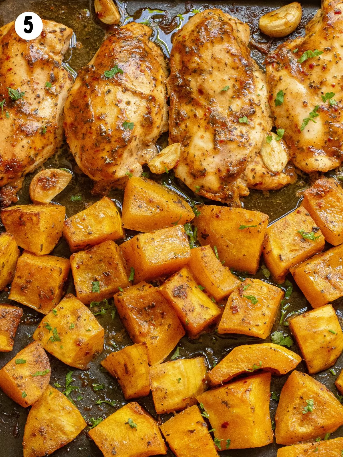 chicken with butternut squash baked on sheet pan.