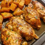 close up of chicken breasts baked on sheet pan.