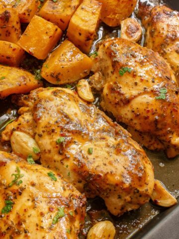 close up of chicken breasts baked on sheet pan.