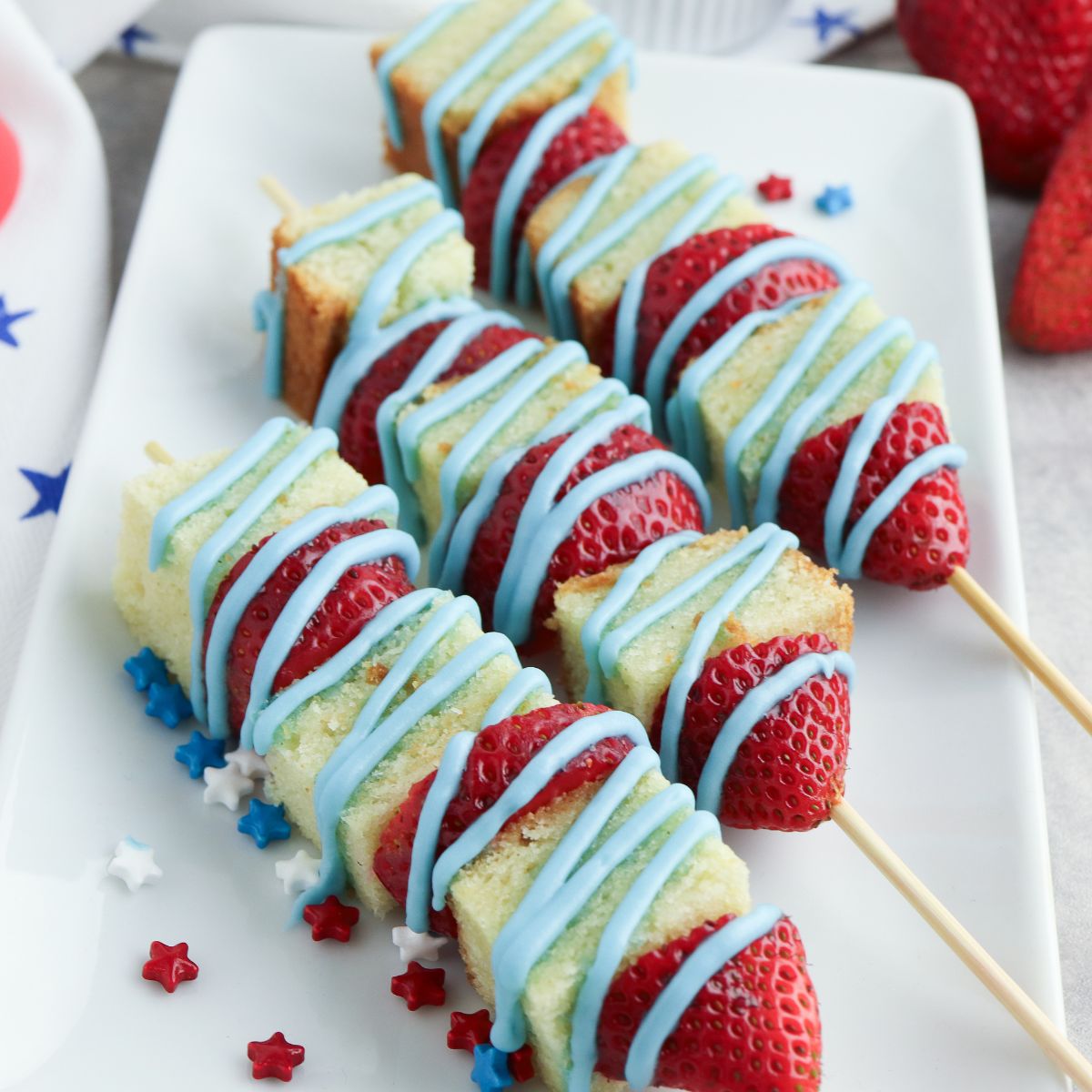pound cake, strawberries with blue powdered sugar icing.