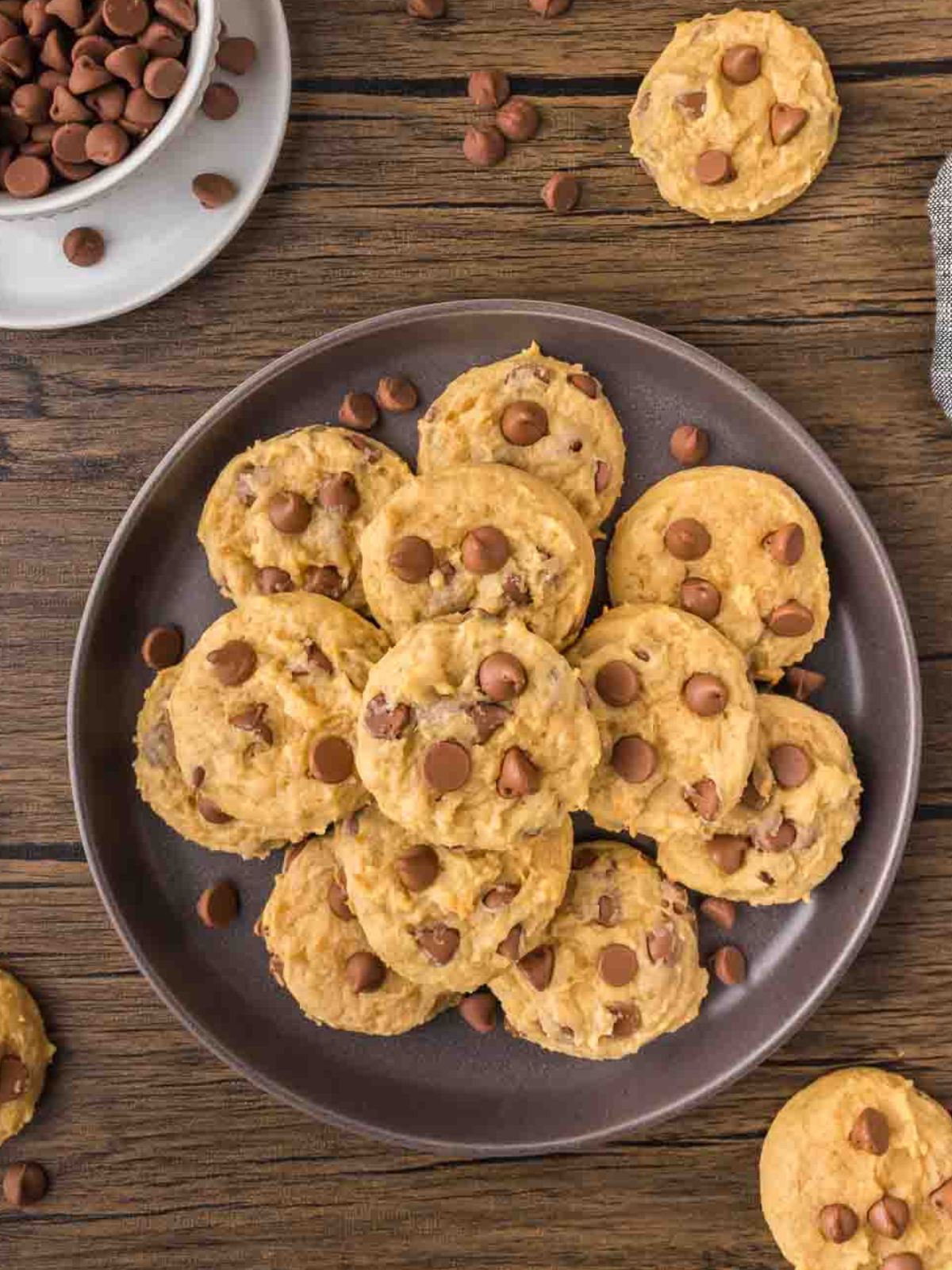 overhead shot of a gray plate filled with chocolate chip cookies