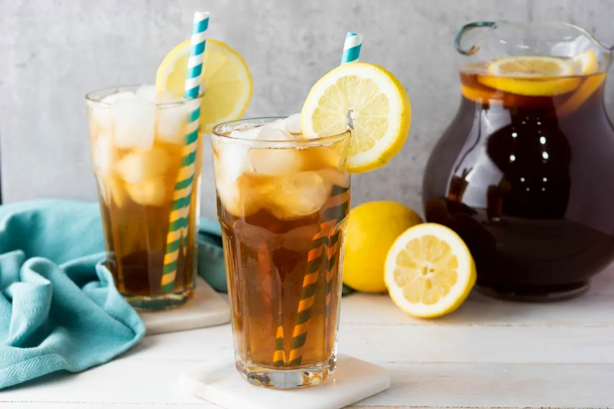 iced tea in glasses with striped straws.