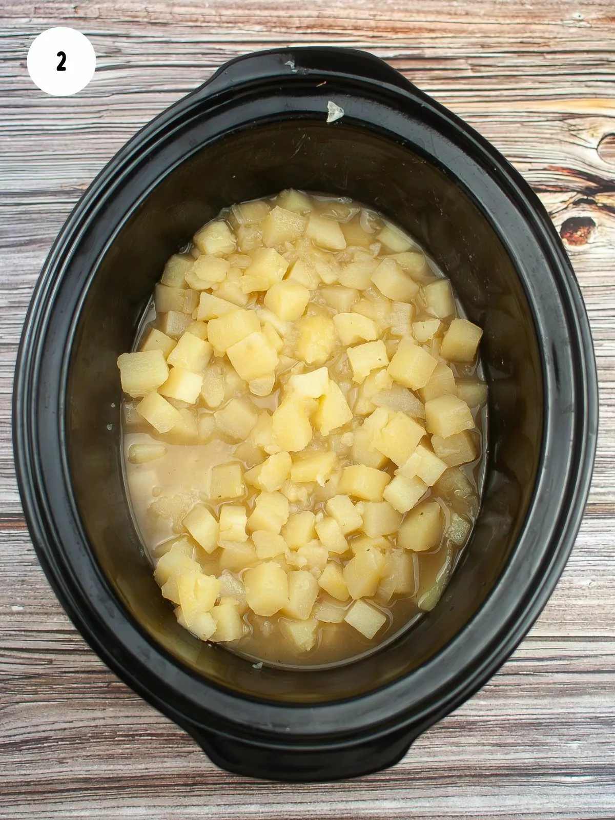 Mix chicken bouillon and water together in slow cooker.