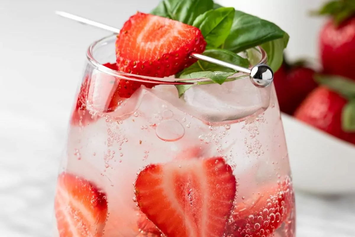 strawberry water with basil and fresh strawberries.