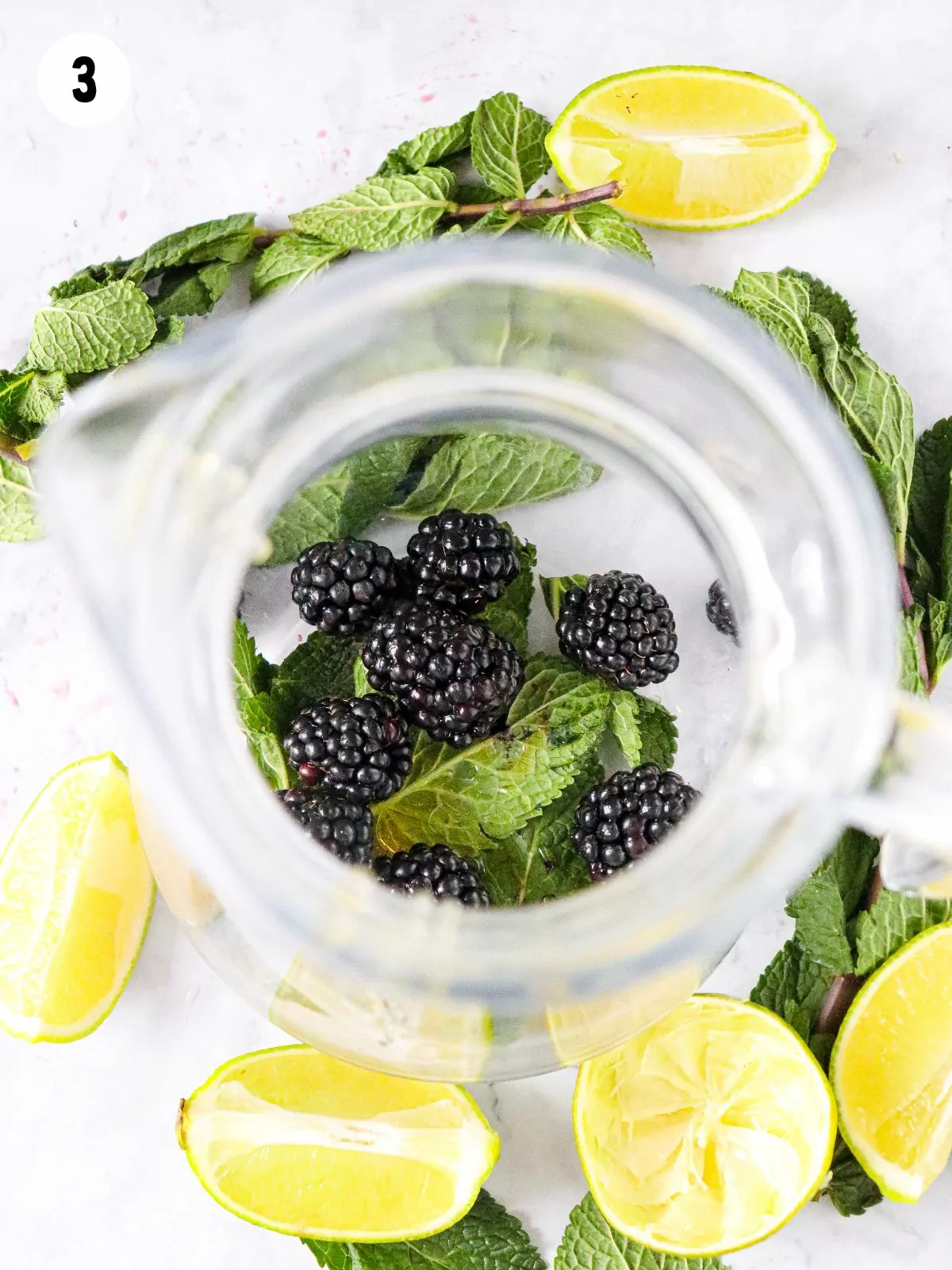 blackberries and mint in pitcher.