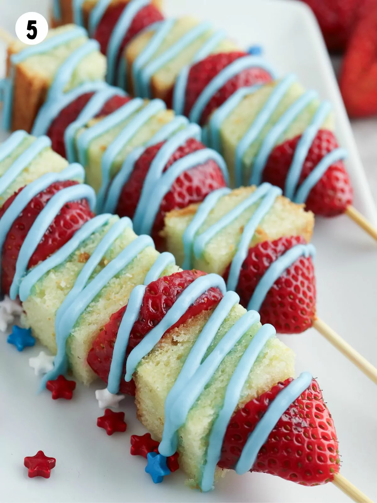 closeup of patriotic kabobs with strawberries and pound cake.