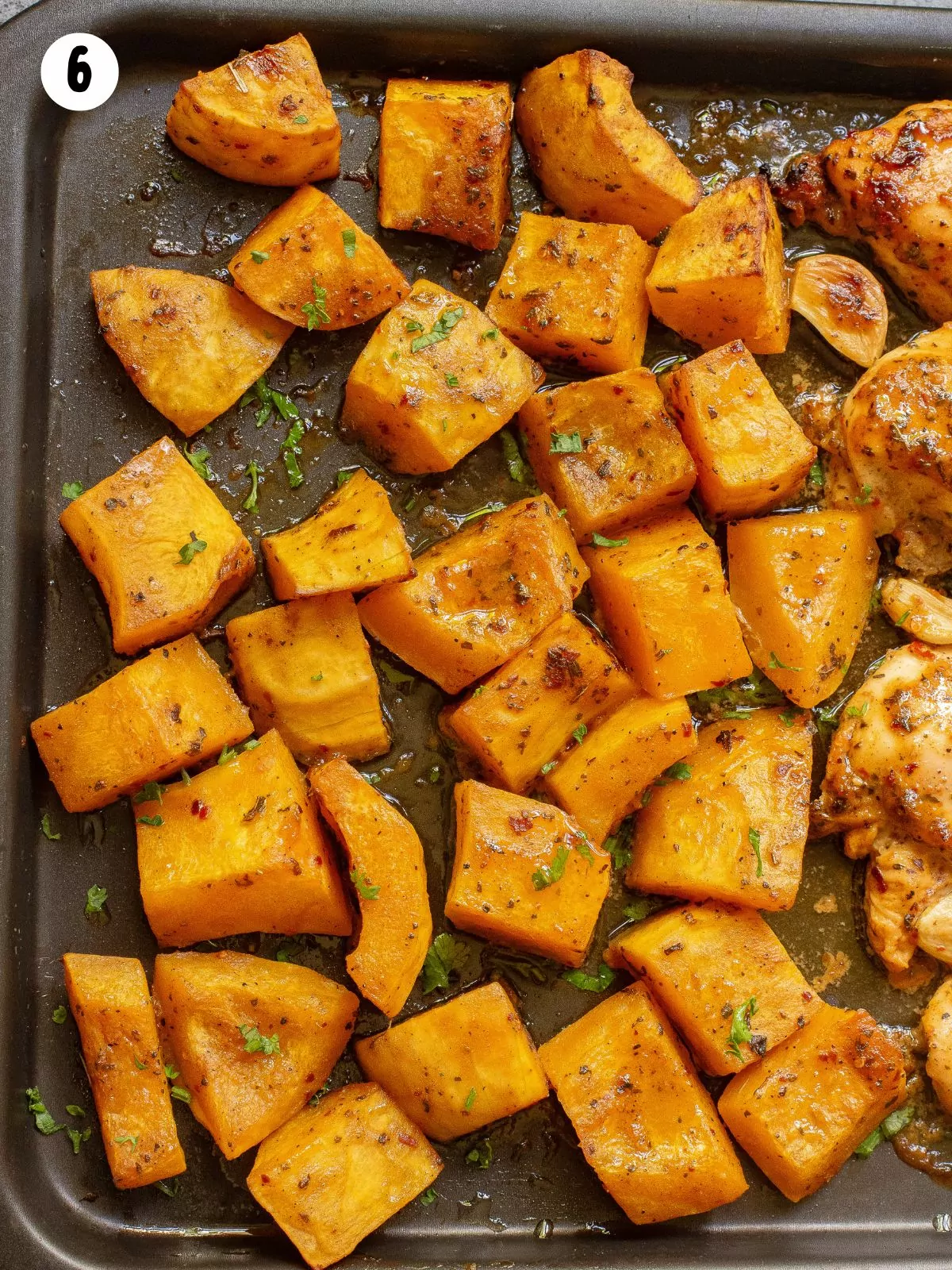 roasted butternut squash cubed on baking tray.