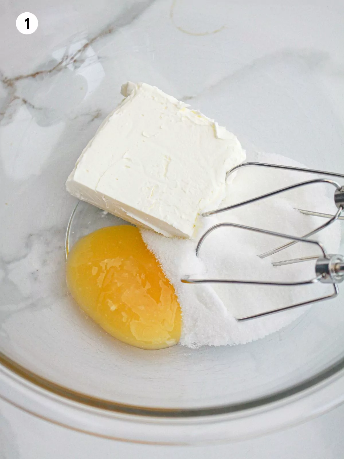 cream cheese, granulated sugar, lemon curd in bowl with electric mixer.