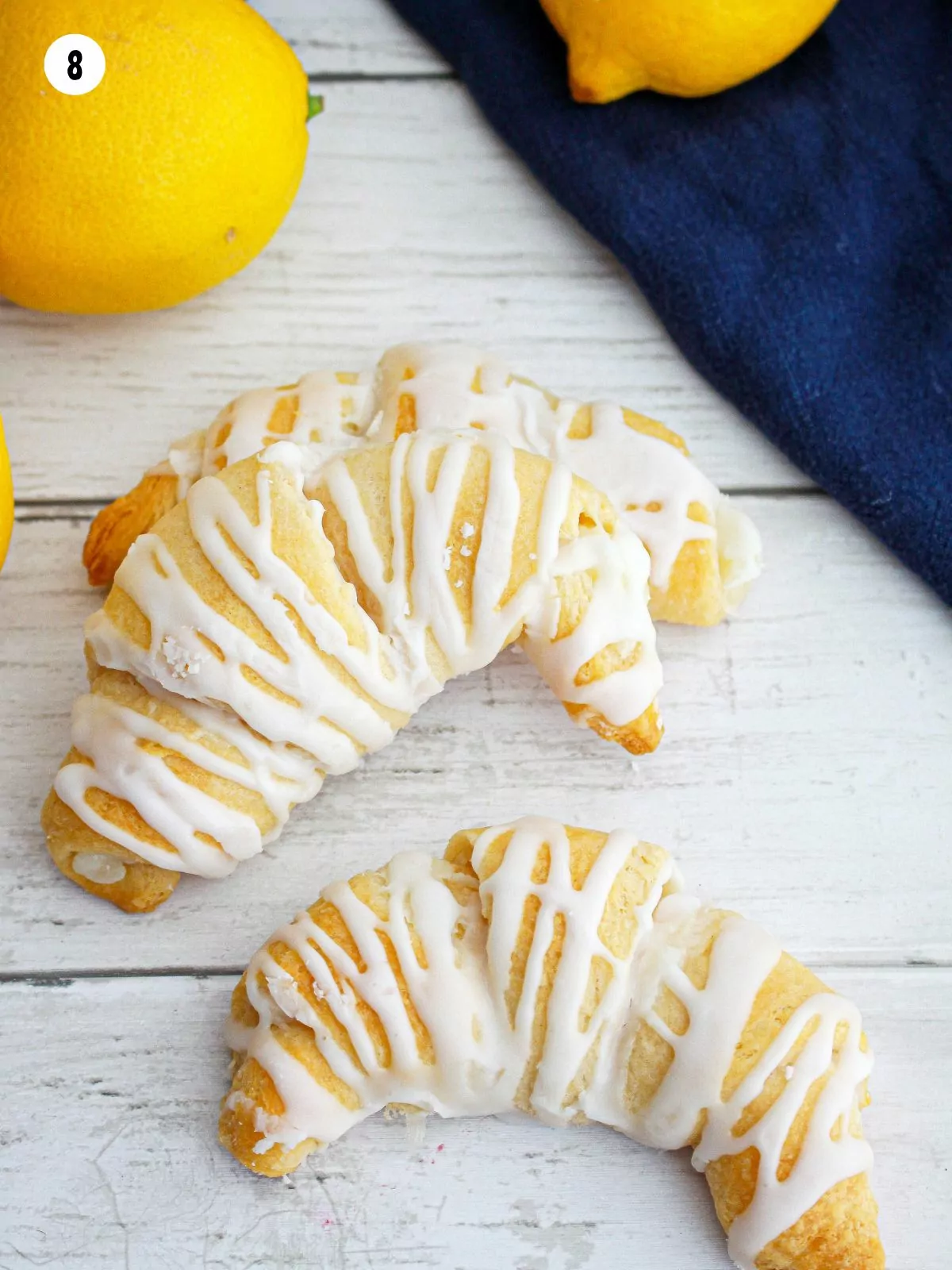 baked danishes on cutting board.