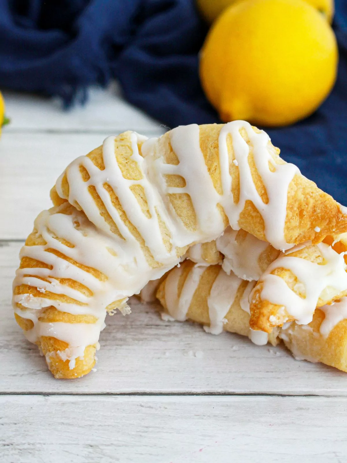 baked crescent rolls topped with powdered sugar glaze.