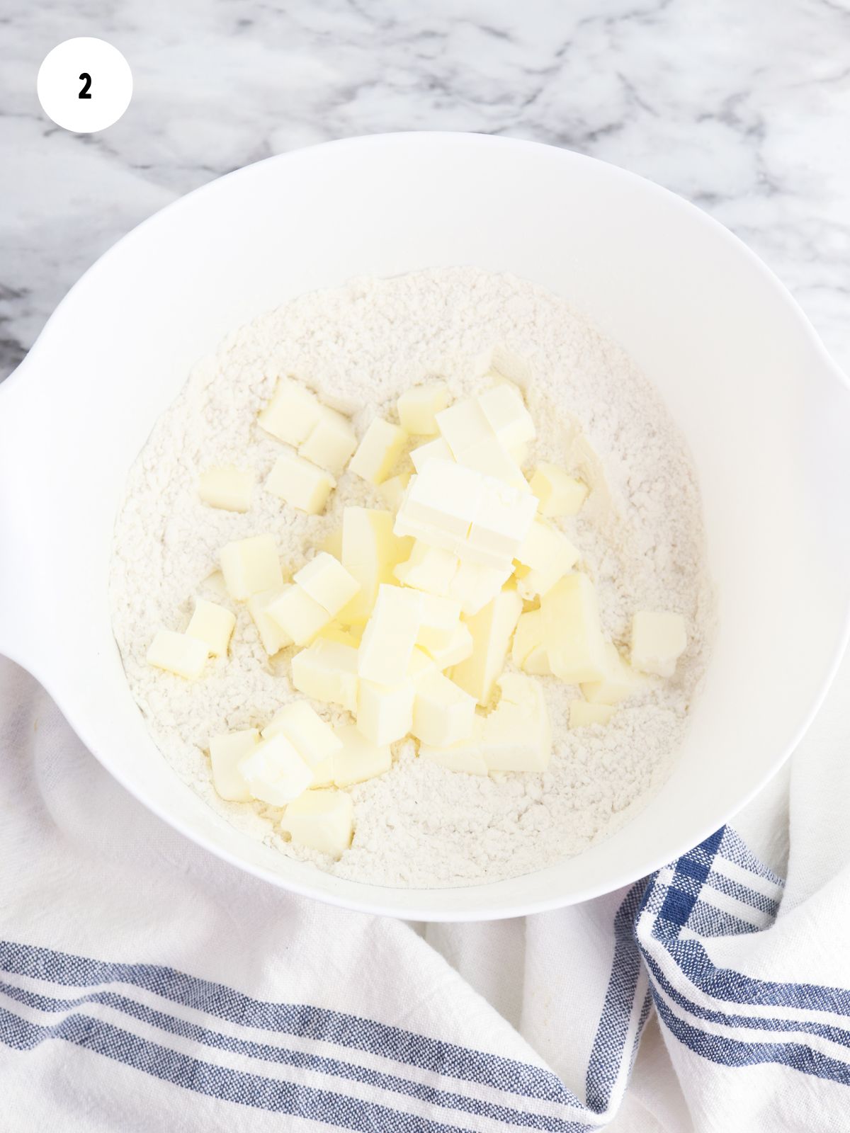Cubed butter added to the flour mixture