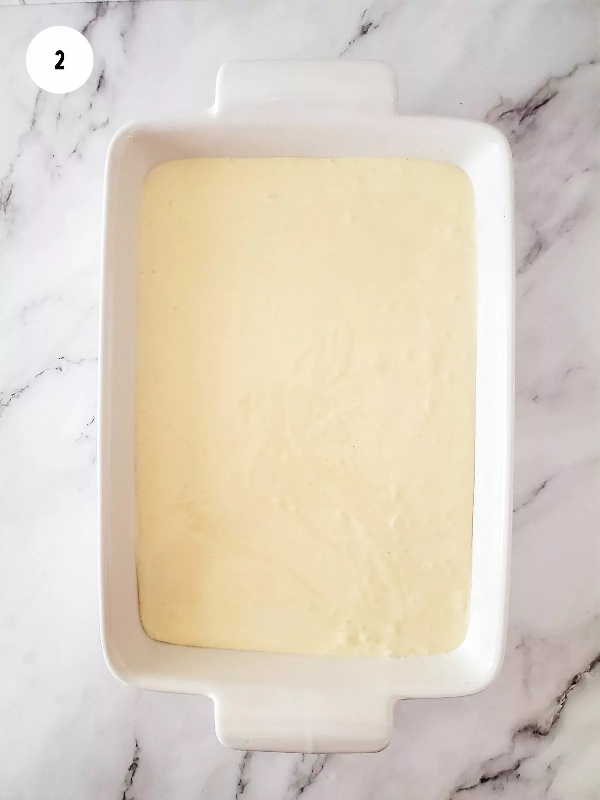 Pour cake batter into greased pan