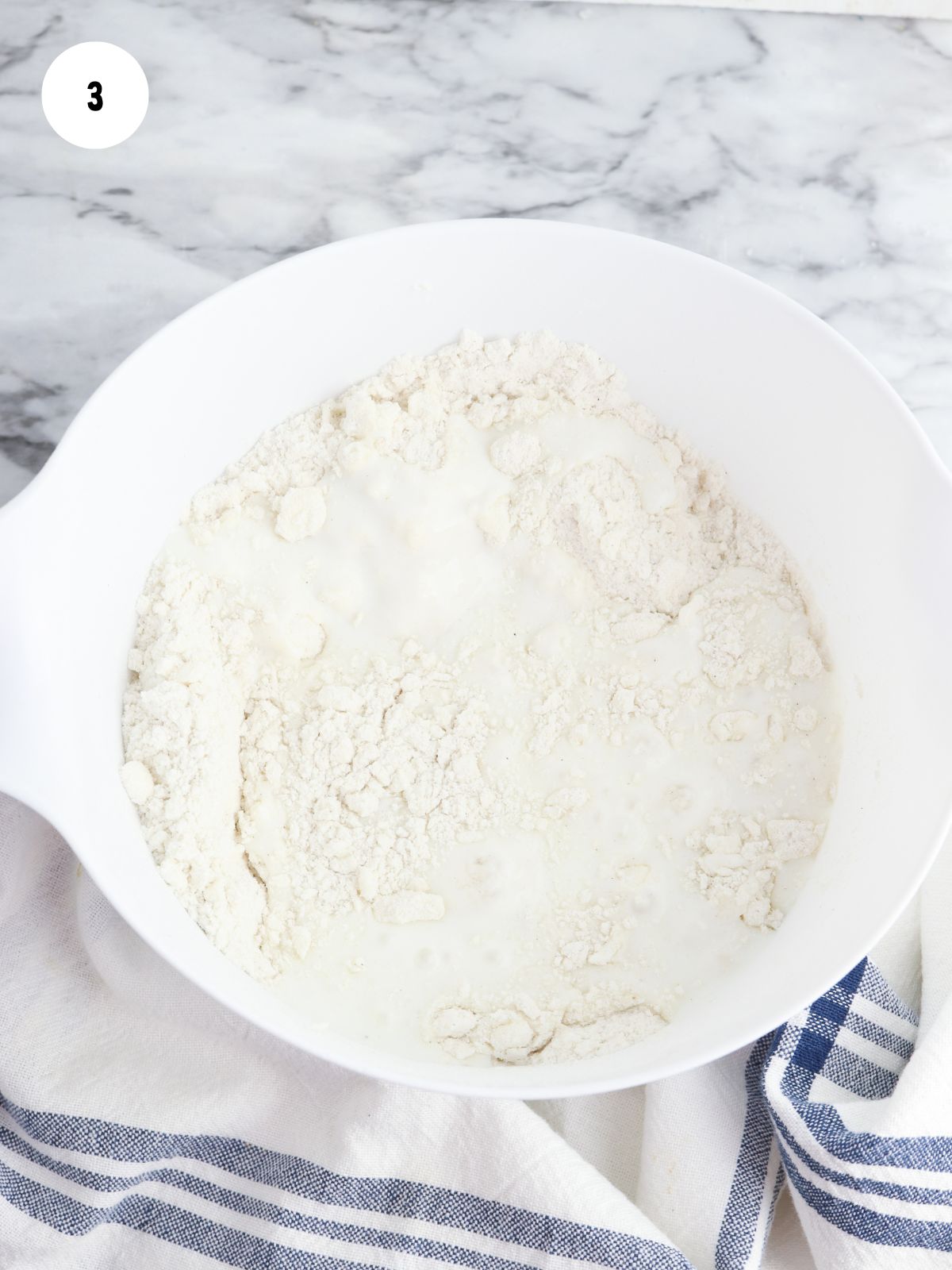 Buttermilk added to the flour and butter mixture
