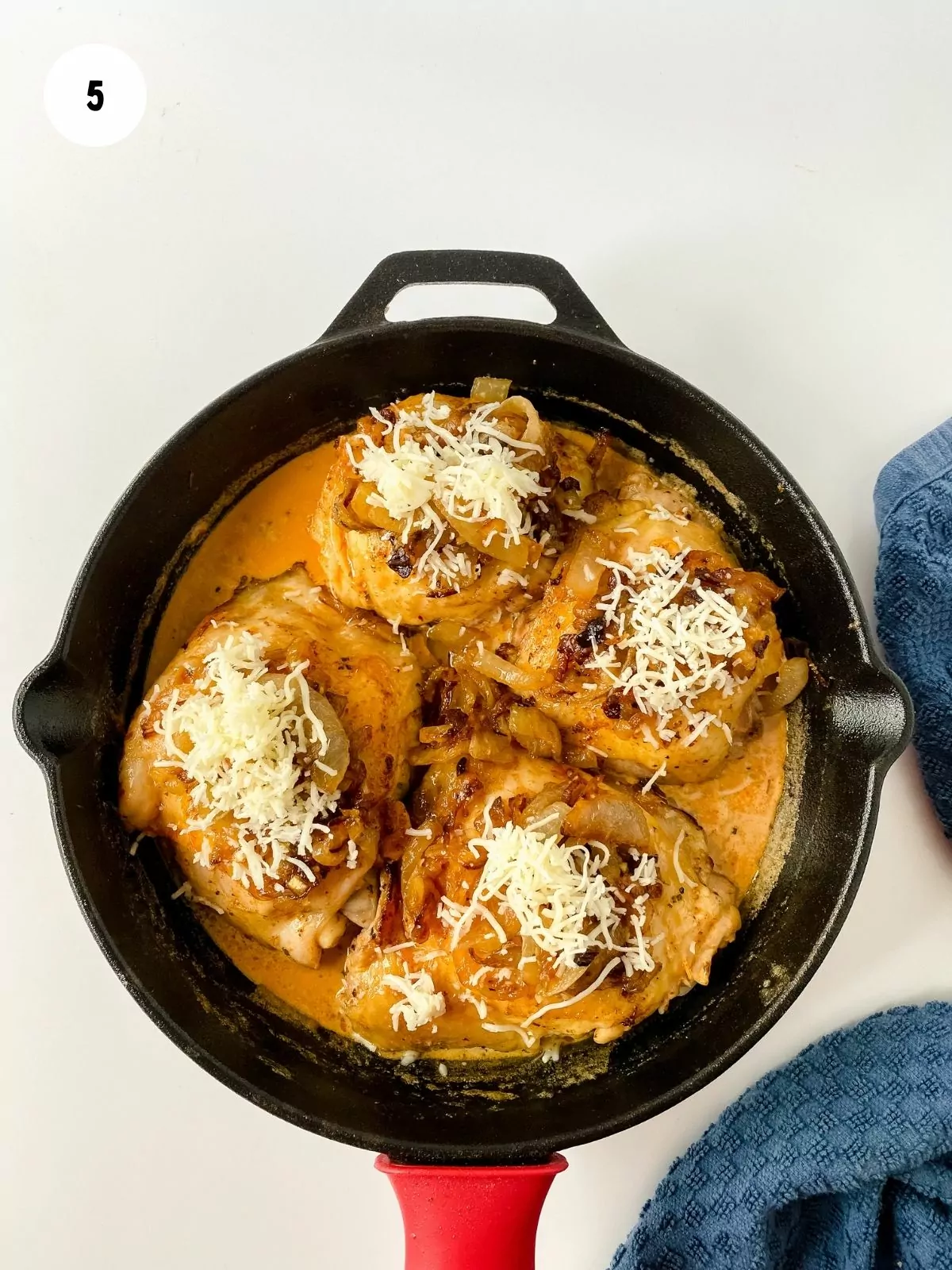 Chicken with onions and mozzarella in cast iron pan
