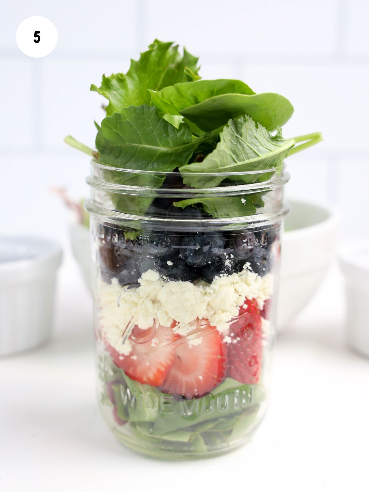 More lettuce add to the final layer of the mason jar salad