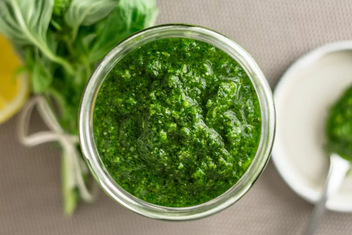 basil pesto in small jar.