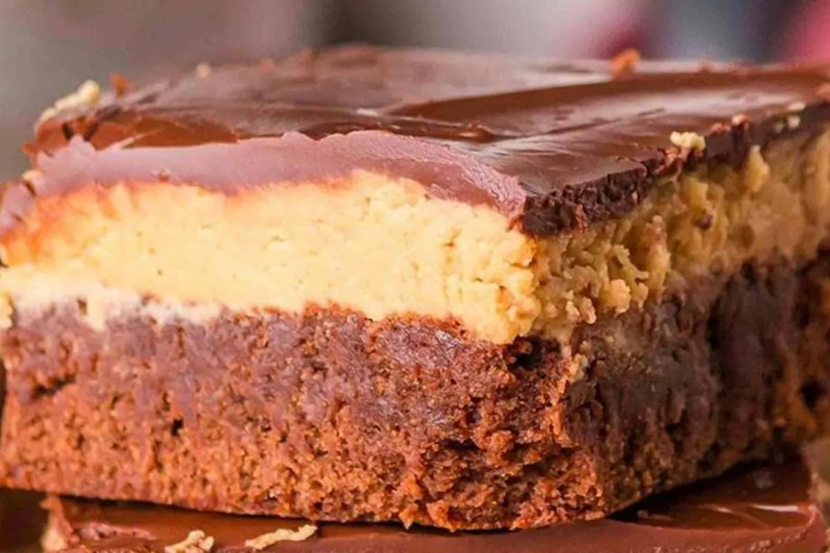 a stack of brownies with buckeye topping.
