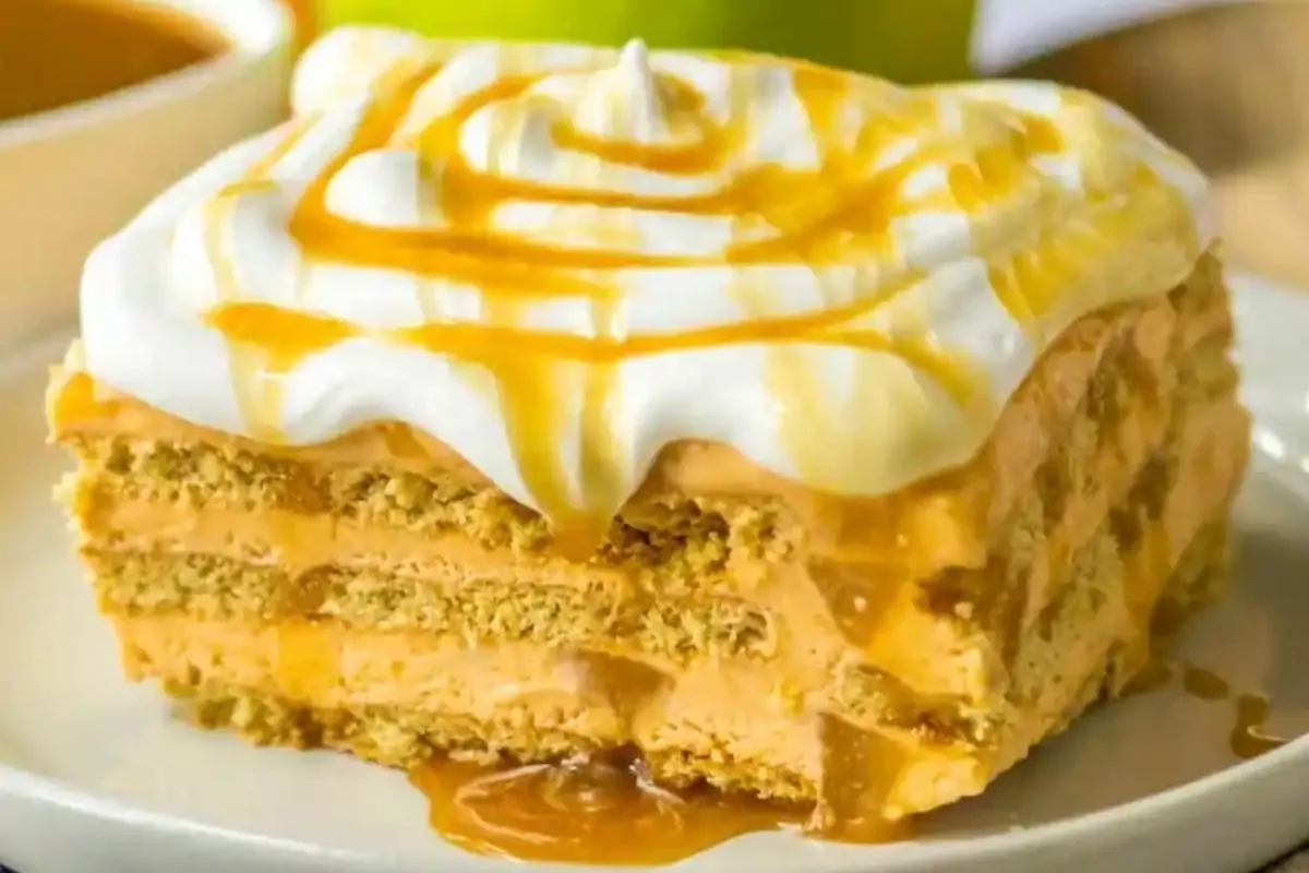 a slice of butterscotch apple icebox cake with caramel topping.