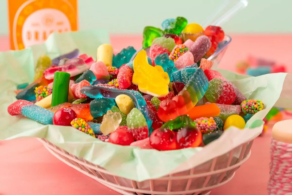 a bowl filled with many kinds of gummy candy.