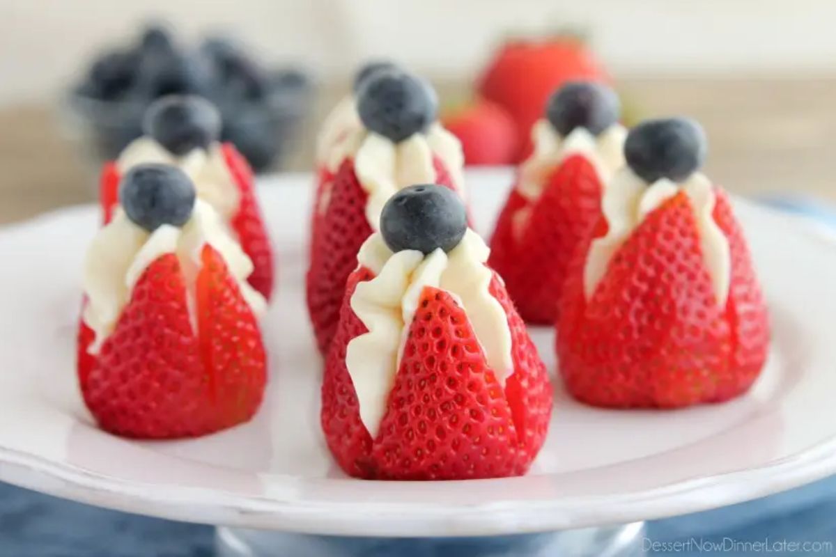 Cheesecake Stuffed Strawberries on white plate.