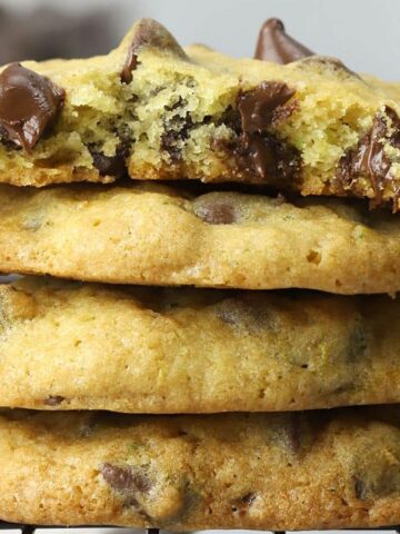 stacked chocolate chip cookies with grated zucchini in batter.