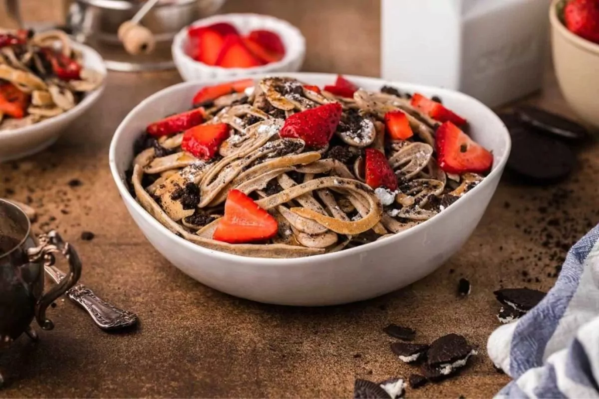 a bowl of pancake spaghetti with berries.