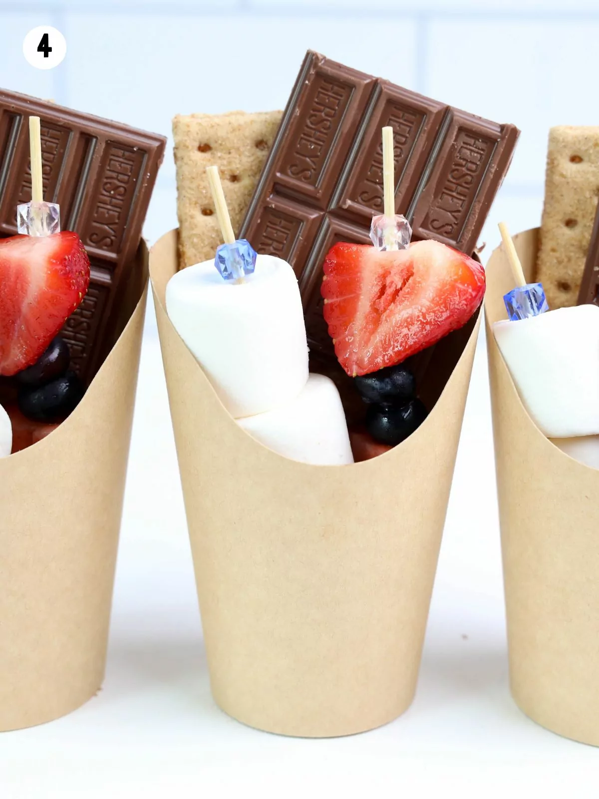 paper cups filled with campfire smores.