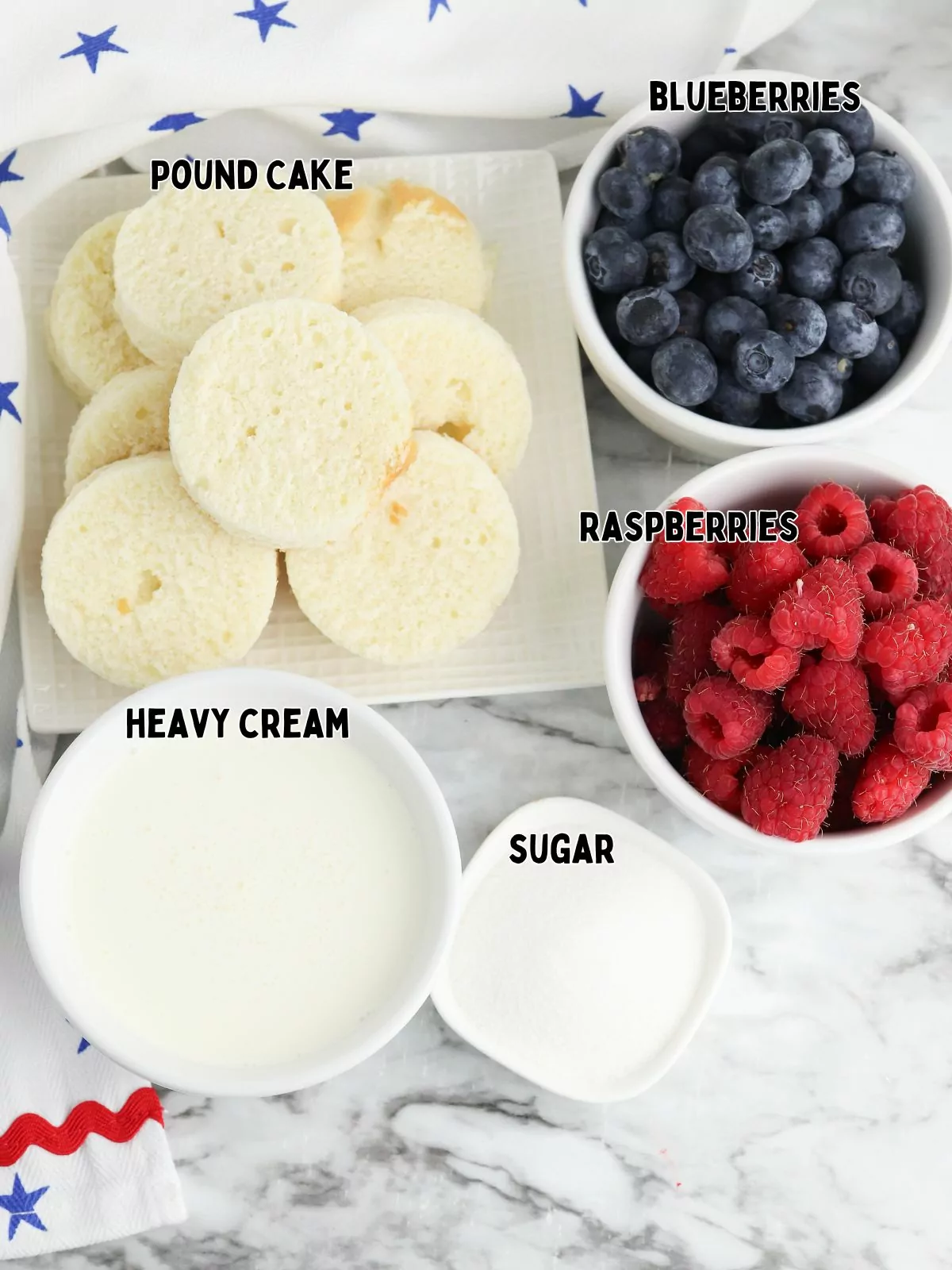 Ingredients, heavy cream, sugar, fresh raspberries, blueberries and pound cake.