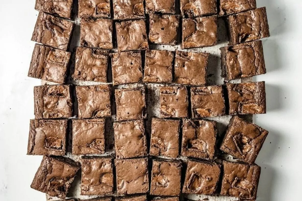 a pan of brownies with milky way candy bars mixed into the batter.