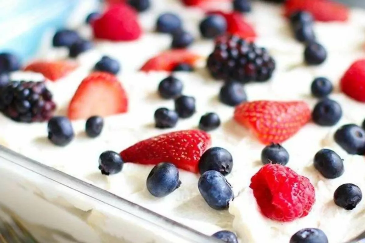 A casserole dish with cool, creamy summer berry icebox cake.