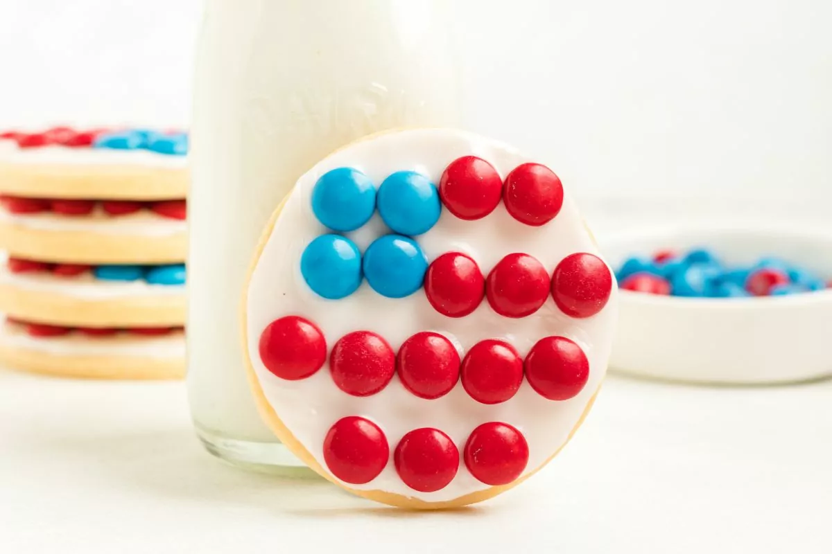 sugar cookies decorated to look like American flags with candy pieces.