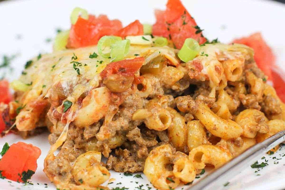 Taco macaroni and beef served on plate.