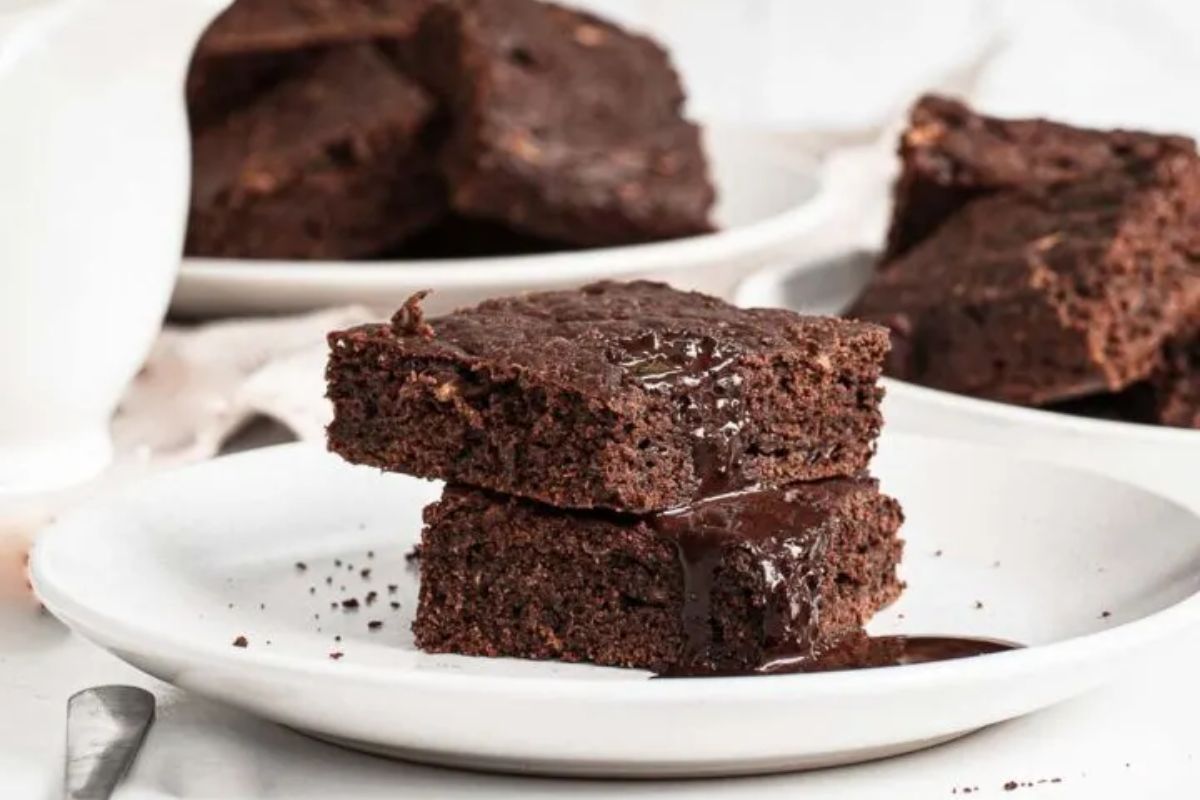 chocolate zucchini brownies on white plate.