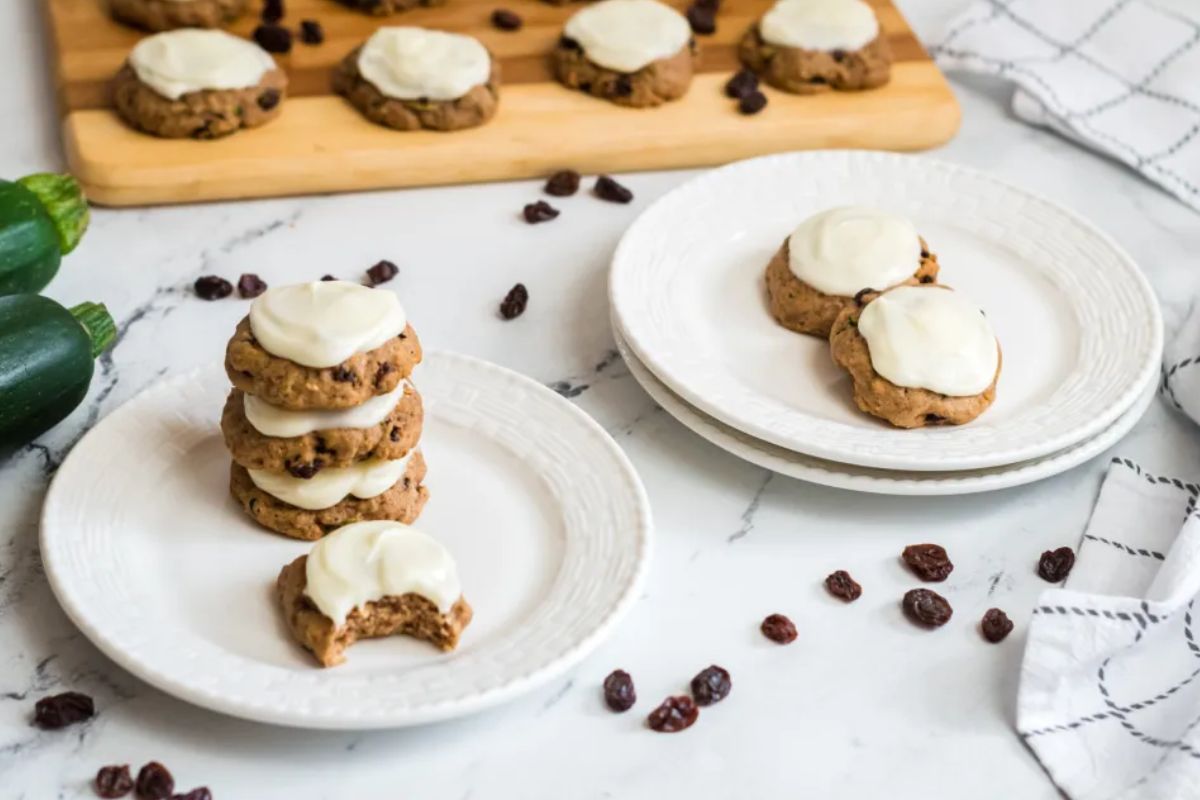 Zucchini Cookies With Cream Cheese Frosting on white plates.
