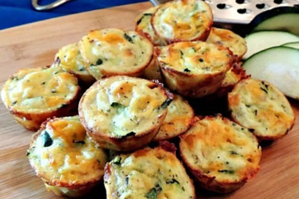 Zucchini puffs stacked on cutting board for MSN.