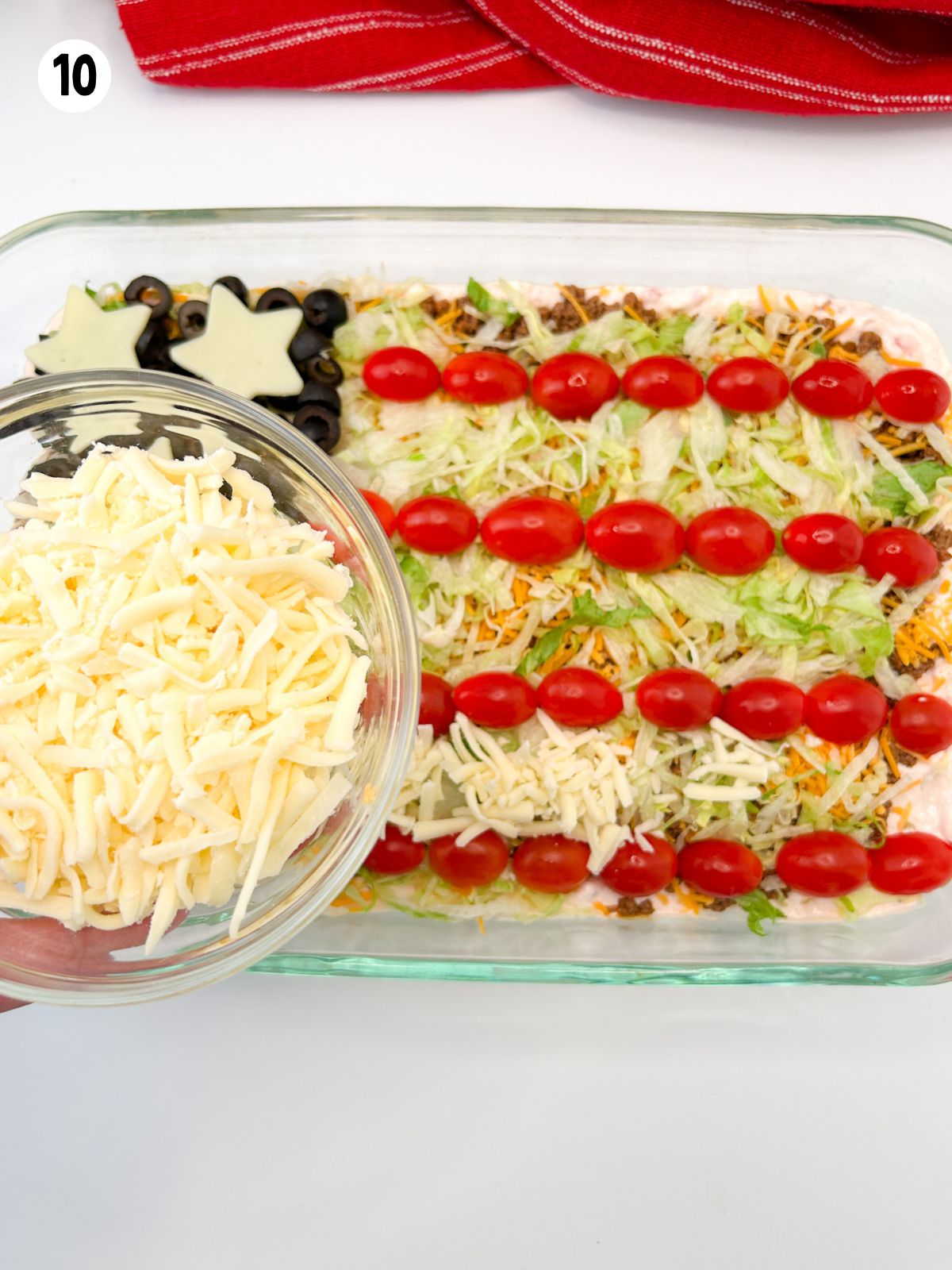 bowl of mozzarella cheese being held over American flag dip.