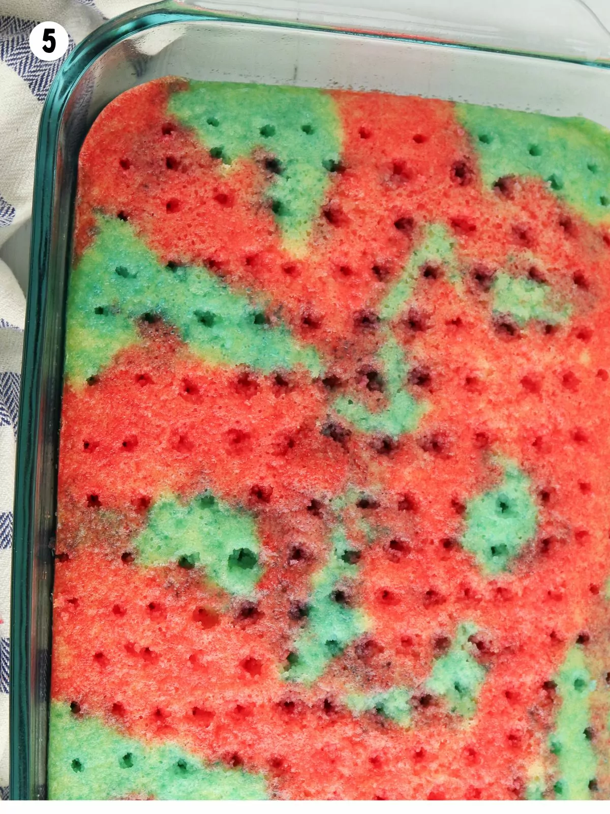 red and blue gelatin poked into a baked cake.