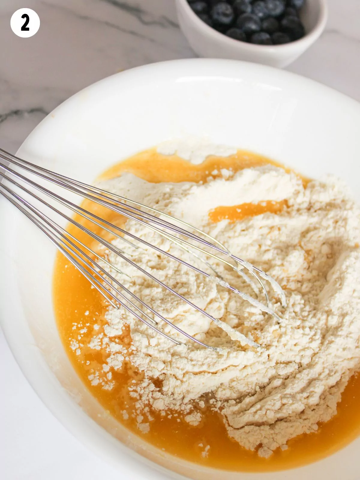 cake mix and melted butter in bowl with wire whisk.