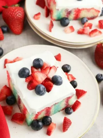 2 pieces of patriotic cake on plates.