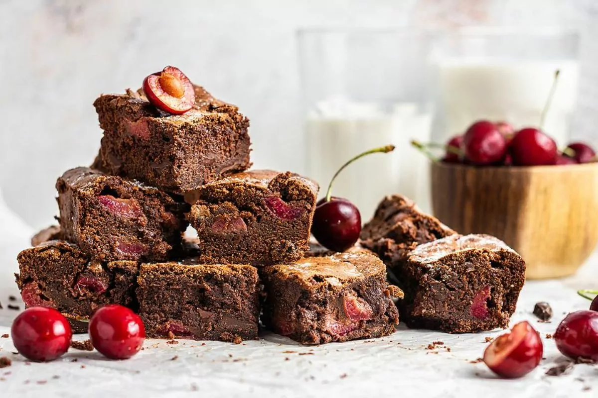 a batch of double chocolate cherry brownies cut into squares.